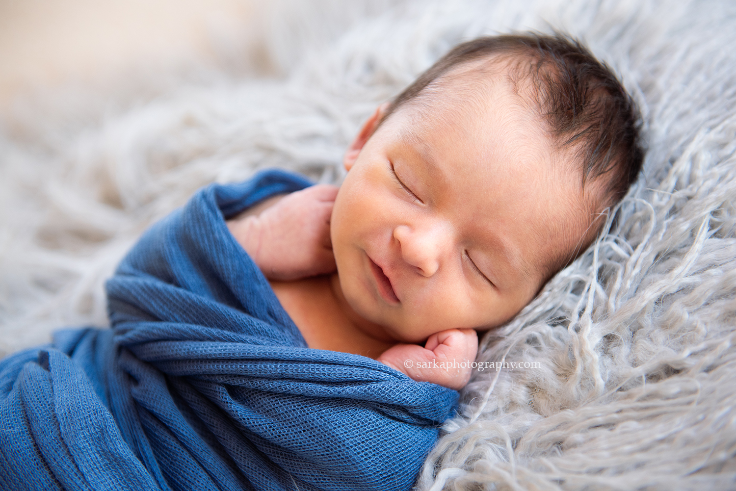 Solvang newborn baby boy smiling when sleeping during his baby portrait session