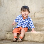 one year old boy sitting on steps photographed by Santa Barbara and San Francisco bay area baby photographer Sarka Photography