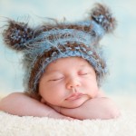 newborn baby sleeping in a hand knitted hat photographed by San Francisco Bay Area and Santa Barbara baby photographer Sarka Photography