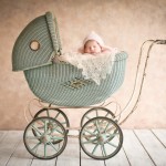 newborn baby girl sleeping in vintage carriage photographed by San Francisco Bay Area and Santa Barbara baby photographer Sarka Photography