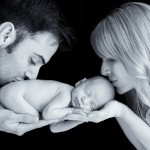 newborn baby boy kissed by his parents photographed by San Francisco Bay Area and Santa Barbara baby photographer Sarka Photography
