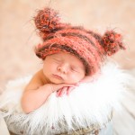 newborn baby boy sleeping in a vintage bucket wearing a hand knitted baby hat photographed by San Francisco Bay Area and Santa Barbara baby photographer Sarka Photography