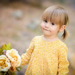 little girl holding flowers photographed by Santa Barbara and San Francisco Bay area photographer Sarka Photography