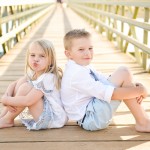 children sitting in a wooden bridge path photographed by Santa Barbara and San Francisco Bay area photographer Sarka Photography