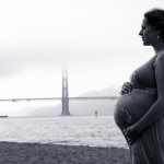 pregnant woman standing on crisp filed beach photographed by Santa Barbara and San Francisco Bay area photographer Sarka Photography