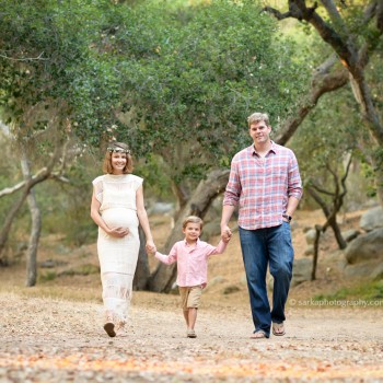 young family walking in a oak tree park photographed by Santa Barbara family photographer Sarka Photography