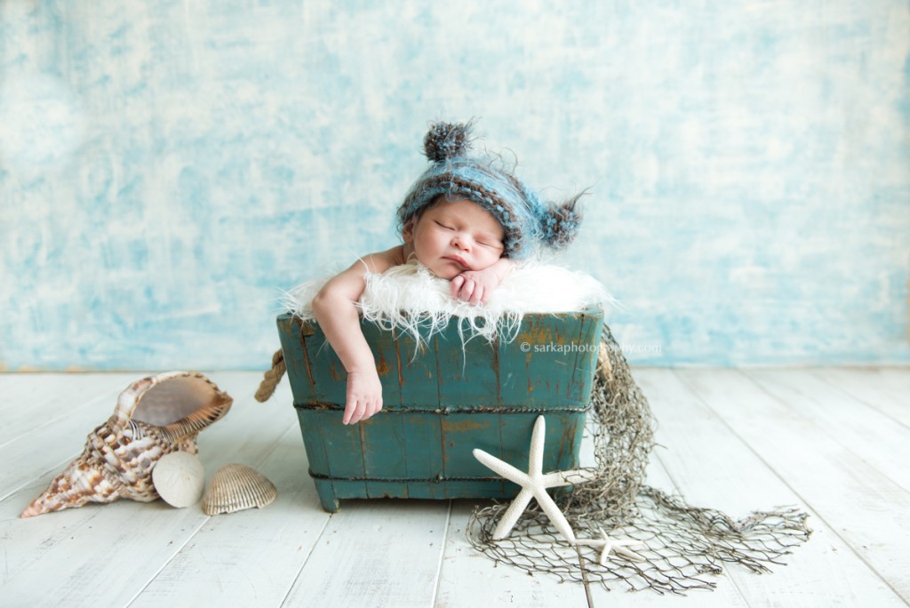 newborn baby boy sleeping in a vintage wood box nautical theme by Santa Barbara Montecito newborn photographer sarkaphotography